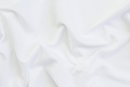 Close up of white bedding sheets with copy-space.の写真素材