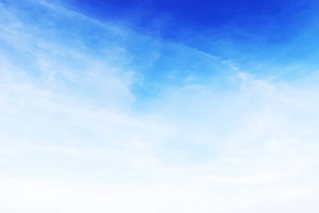 Soft white clouds against blue sky background and empty space for your design.の写真素材