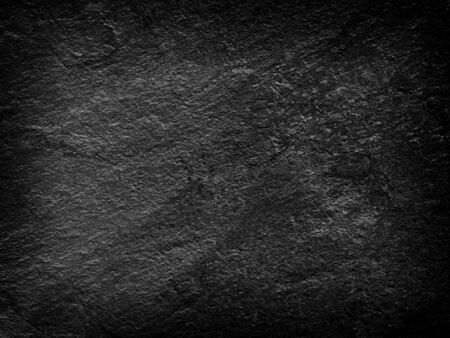 Dark gray black slate stone background or texture and empty space.の写真素材