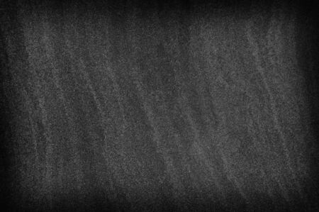 Dark gray black slate stone background or texture and empty space.の写真素材