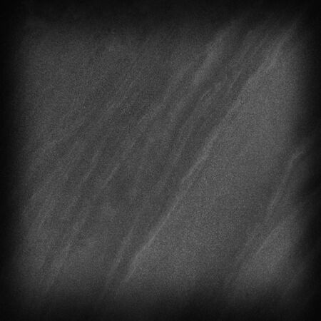 Dark gray black slate stone background or texture and empty space.の写真素材