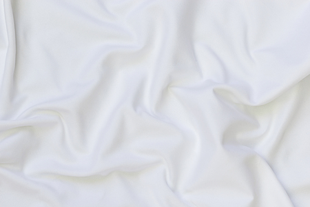 Close up of white bedding sheets and empty space.の写真素材