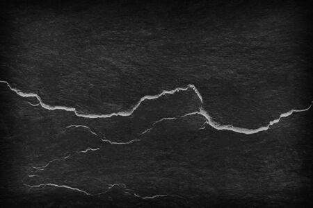 Dark gray black slate stone background or texture and empty space.の写真素材
