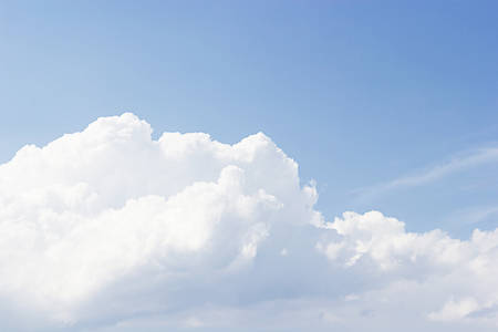 White clouds against blue sky background and empty space for your design.の写真素材