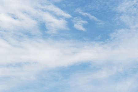 Soft white clouds against blue sky background and empty space for your design.の写真素材