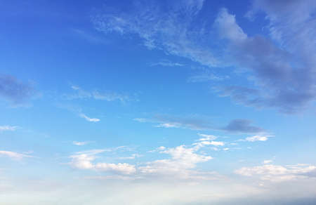 Soft white clouds against blue sky background and empty space for your design.の写真素材