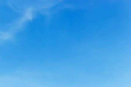 Soft white clouds against blue sky background and empty space for your design.の写真素材