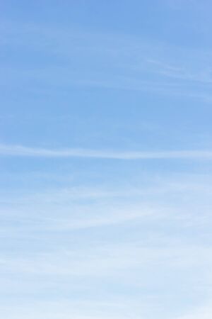 Soft white clouds against blue sky background and empty space for your design.の写真素材