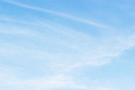 Soft white clouds against blue sky background and empty space for your design.の写真素材