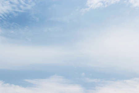 Soft white clouds against blue sky background and empty space for your design.の写真素材