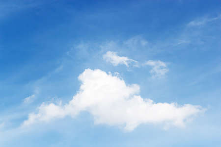 Soft white clouds against blue sky background and empty space for your design.の写真素材