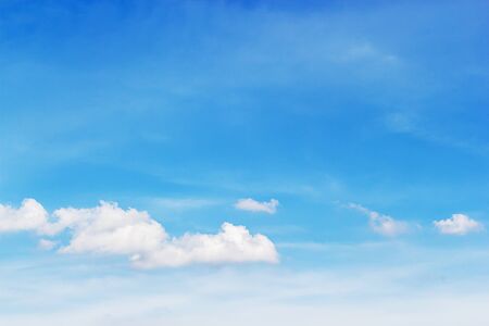 Soft white clouds against blue sky background and empty space for your design.の写真素材