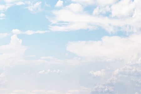 Soft white clouds against blue sky background and empty space for your design.の写真素材