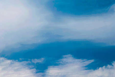 Soft white clouds against blue sky background and empty space for your design.の写真素材