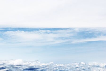 Soft white clouds against blue sky background and empty space for your design.の写真素材