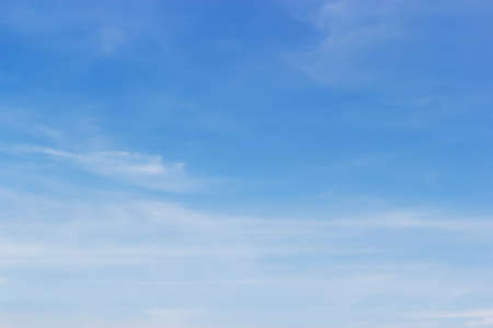 Soft white clouds against blue sky background and empty space for your design.の写真素材