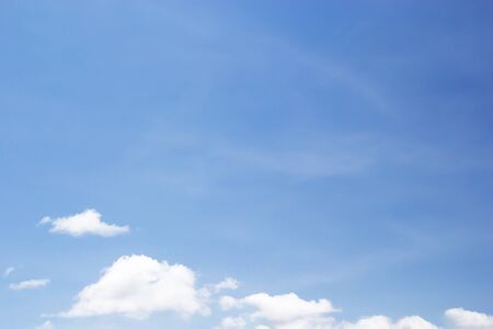 Soft white clouds against blue sky background and empty space for your design.の写真素材
