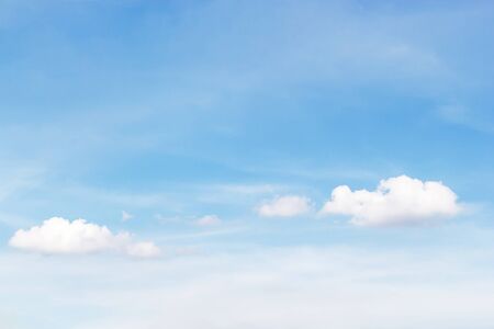 Soft white clouds against blue sky background and empty space for your design.の写真素材