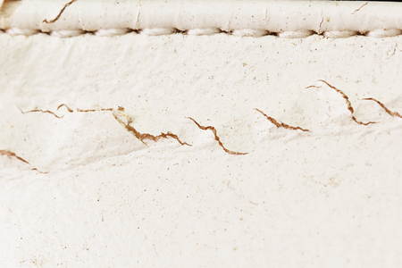 Old white leather have cracks background or textureの写真素材