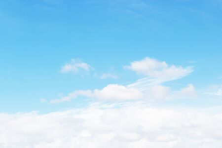 Soft white clouds against blue sky background and empty space for your design, beautiful of natureの写真素材