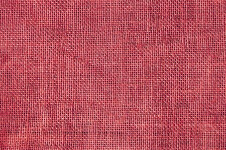 Red light sackcloth texture Christmas background.の写真素材