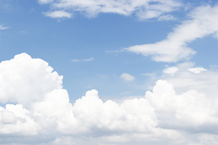 Soft white clouds against blue sky background and empty space for your design, beautiful of nature.の写真素材