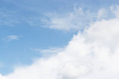 Blue sky background and white clouds soft focus, beautiful of nature.の写真素材