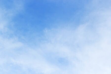 Soft white clouds against blue sky background and empty space for your design, beautiful of nature.の写真素材