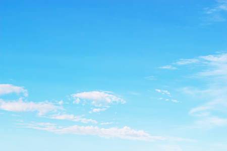 Soft white clouds against blue sky background and empty space.の写真素材