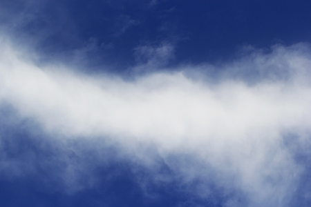 Soft white clouds against blue sky background and empty space for your design, beautiful of nature.の写真素材