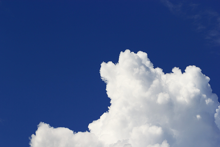 Soft white clouds against blue sky background and empty space for your design, beautiful of nature.の写真素材