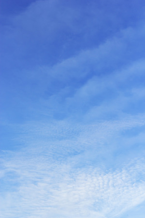 Soft white clouds against blue sky background and empty space.の写真素材