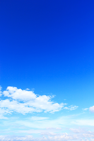 Soft white clouds against blue sky background and empty space for your design, beautiful of nature.の写真素材