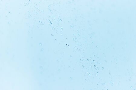 Background of water drops on glass.の写真素材