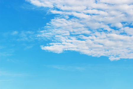 Soft white clouds against blue sky background and empty space for your design, beautiful of nature.の写真素材