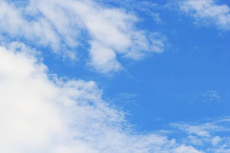 Soft white clouds against blue sky background and empty space for your design, beautiful of nature.の写真素材