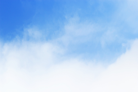 Soft white clouds against blue sky background and empty space.の写真素材