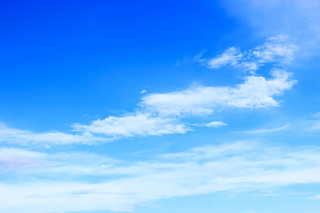 Soft white clouds against blue sky background and empty space.の写真素材