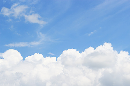 Blue sky and soft white clounds and empty space for your design.の写真素材