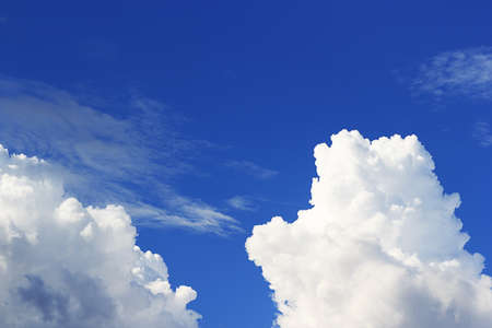 Blue sky and white clounds and empty space for your design.の写真素材