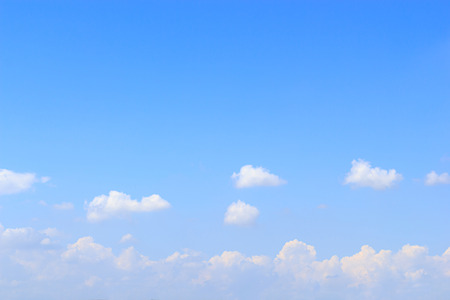 Blue sky and soft white clounds and empty space for your design.の写真素材