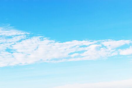 Soft white clouds against blue sky background and empty space.の写真素材