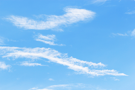 Soft white clouds against blue sky background and empty space for your design, beautiful of nature.の写真素材