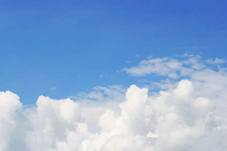 Soft white clouds against blue sky background and empty space for your design, beautiful of nature.の写真素材