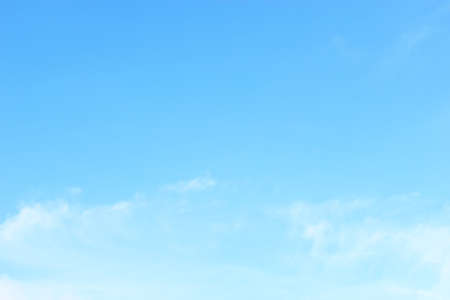 Soft white clouds against blue sky background and empty space for your design, beautiful of nature.の写真素材