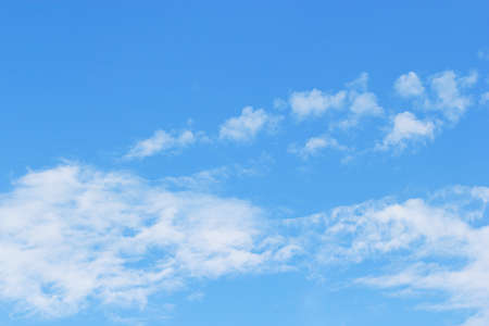 Soft white clouds against blue sky background and empty space for your design, beautiful of nature.の写真素材