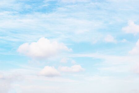 Blue sky and soft white clounds and empty space for your design.の写真素材