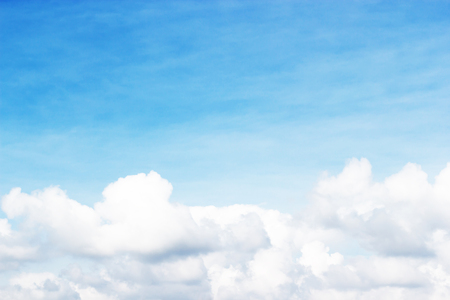 Soft white clouds against blue sky background and empty space.の写真素材