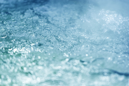 Water abstract background or texture with glitter light soft focus and blurred bokeh circles.の写真素材