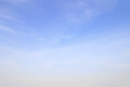 Blue sky background and white clouds soft focus, and empty space.の写真素材